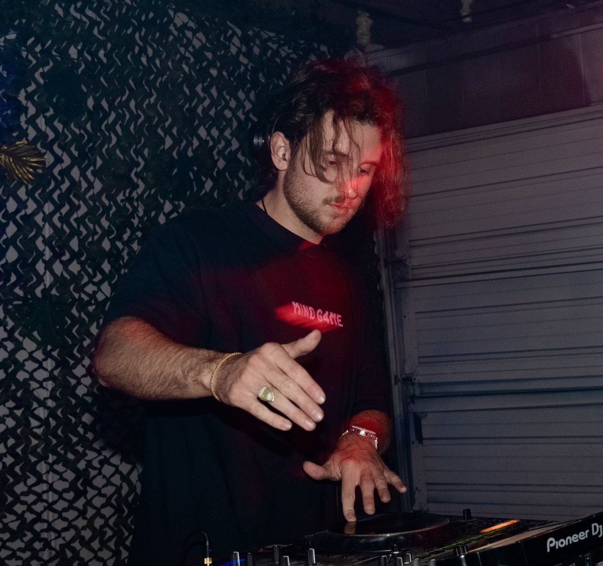 MIND G4ME deep in a set under red light